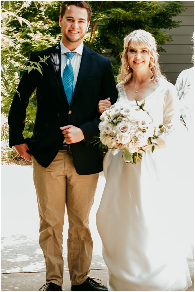 flowery branch wedding photographer takes pictures of the wedding ceremony at Juliette Chapel, a wedding venue in Dahlonega, Ga, hidden wooded wedding venue 