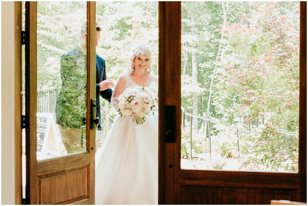 flowery branch wedding photographer takes pictures of the wedding ceremony at Juliette Chapel, a wedding venue in Dahlonega, Ga, hidden wooded wedding venue 