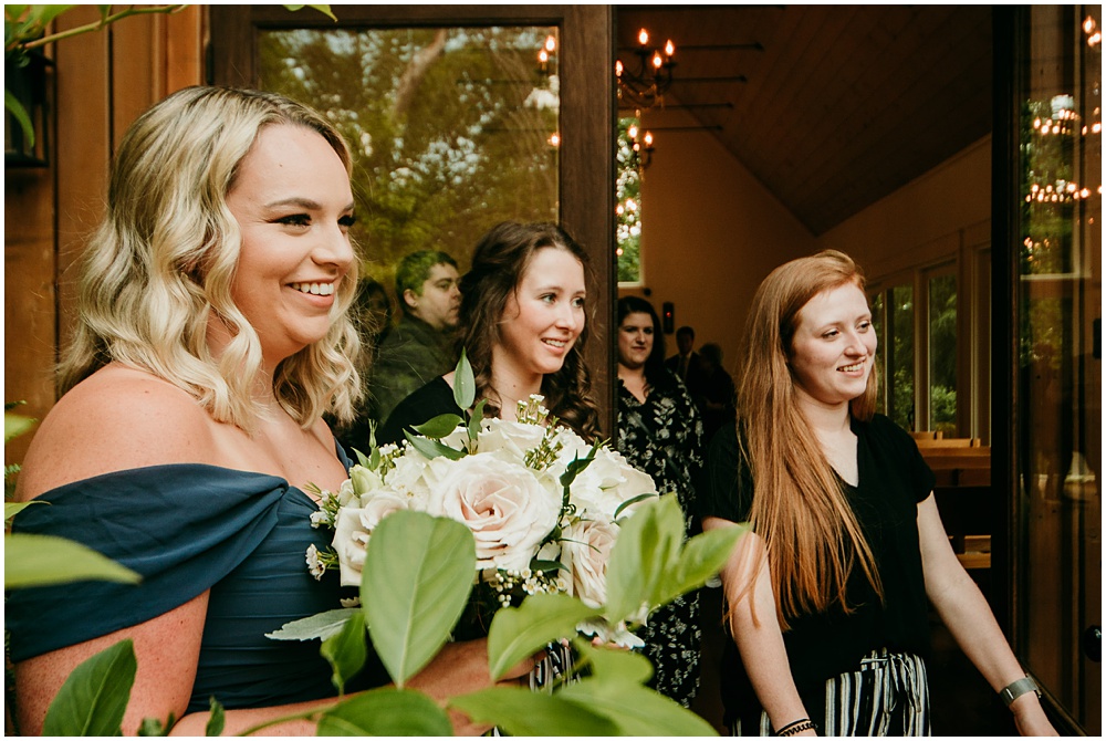 flowery branch wedding photographer takes pictures of the wedding ceremony at Juliette Chapel, a wedding venue in Dahlonega, Ga, hidden wooded wedding venue 