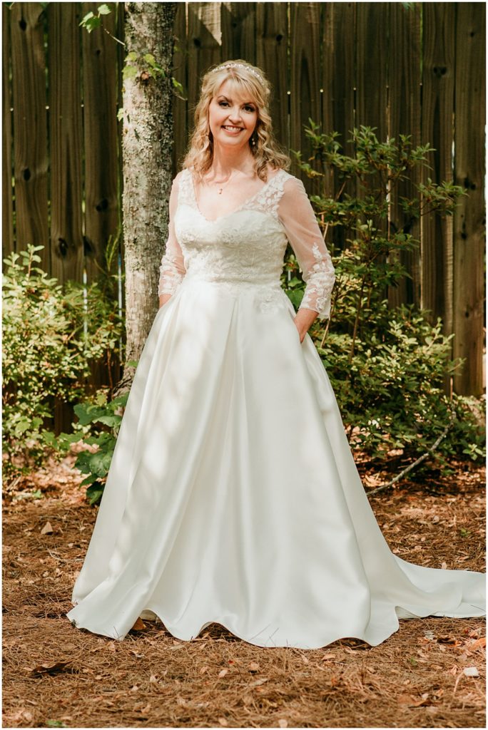 flowery branch wedding photographer takes pictures of the Bride at Juliette Chapel, a wedding venue in Dahlonega, Ga, hidden wooded wedding venue 