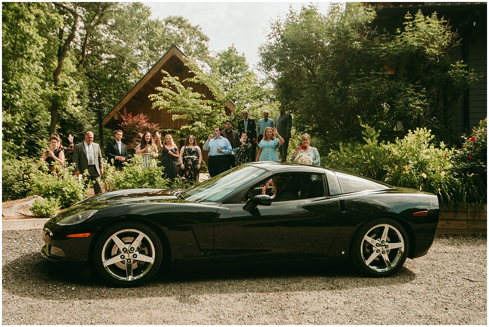 flowery branch wedding photographer takes pictures of the Bride and Grooms exit at Juliette Chapel, a wedding venue in Dahlonega, Ga, hidden wooded wedding venue 