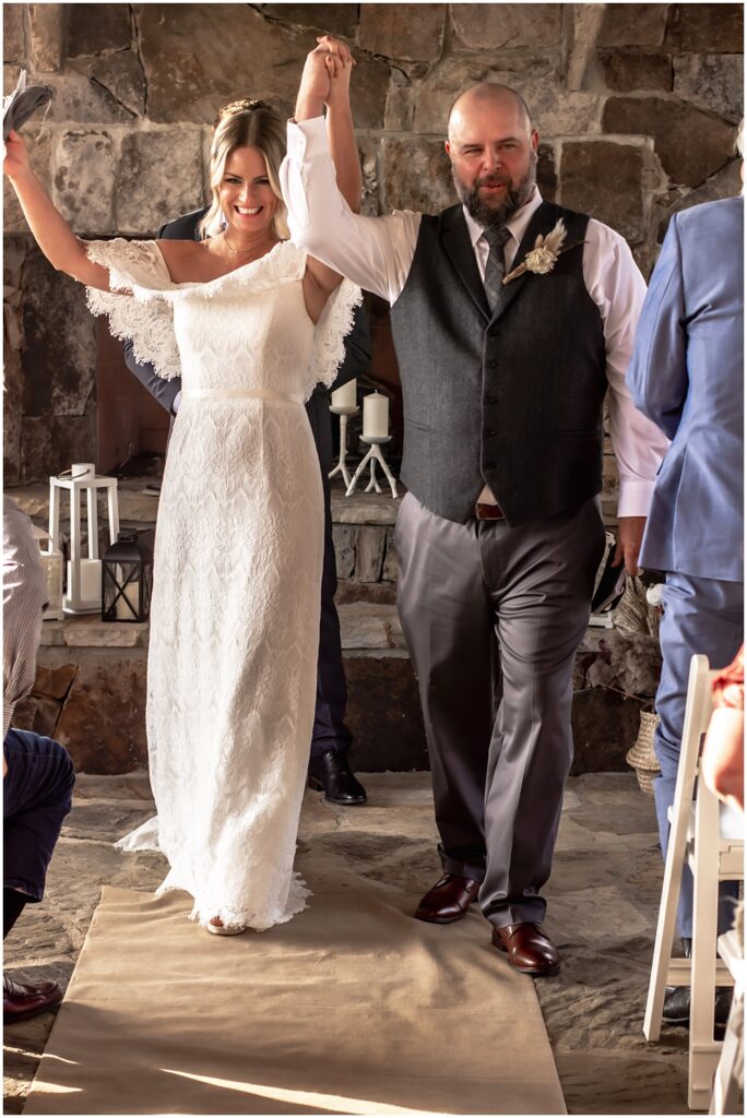 the bride and groom leaving their ceremony at sterling on the lake in flowery branch ga 