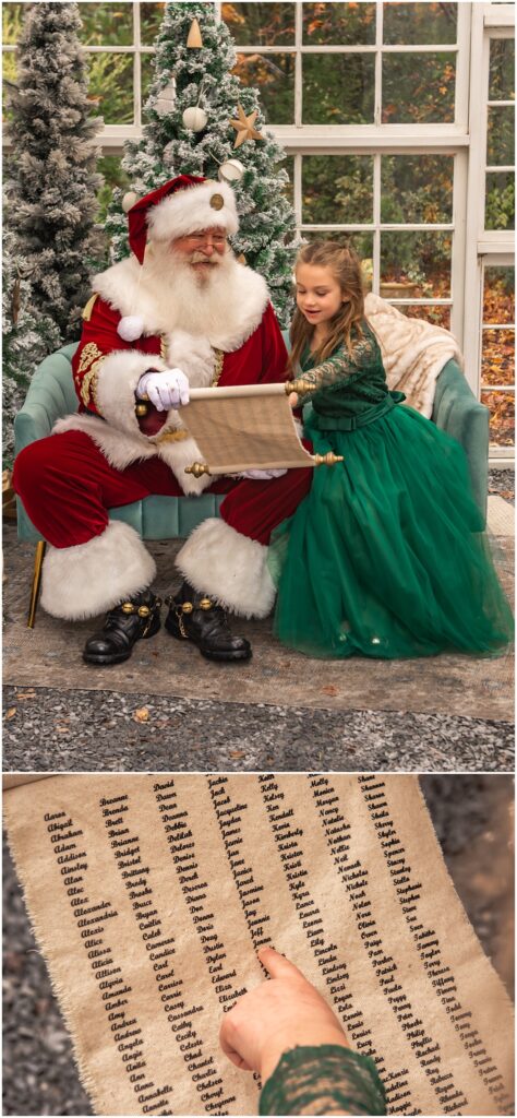 little girl sitting next to santa looking at her name on the scroll, during her santa mini session at prospect farms, in lawrenceville ga 