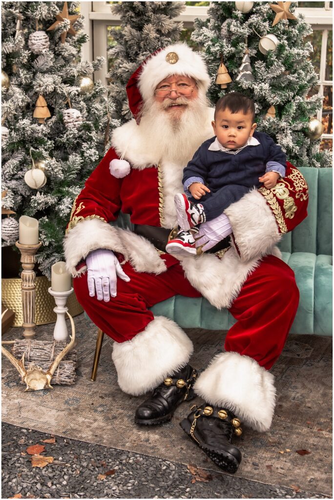 young boy sitting with Santa, during his Santa mini session at Prospect Farms, in Lawrenceville, Ga 