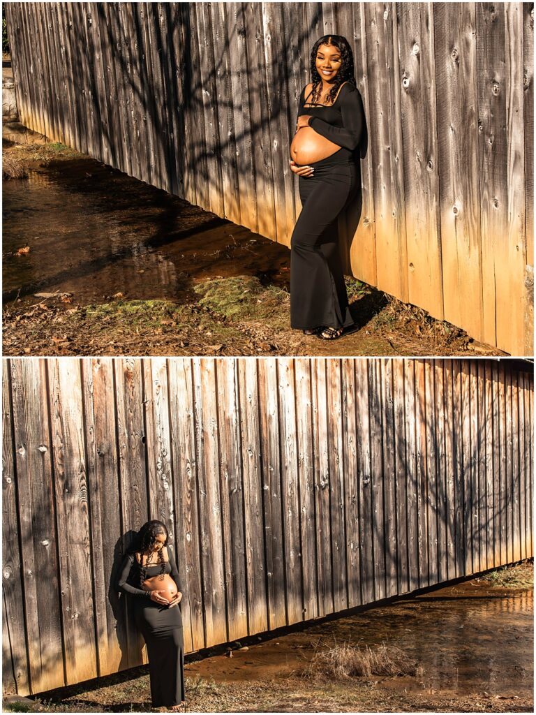 maternity session at Gerrard Landing Park in Roswell, Georgia. Mom is wearing a black dress with the stomach open for viewing. Mom is leaning against a covered bridge with her hands on her belly