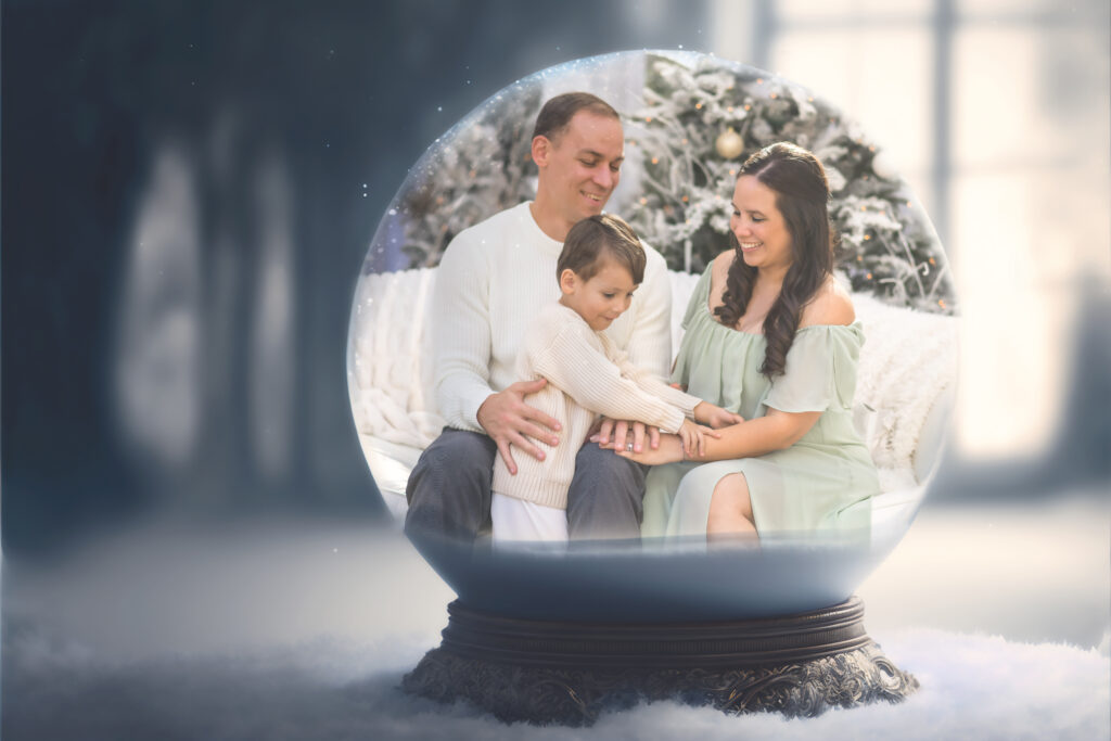 composite of family mini session inside of a snow globe for christmas minis 