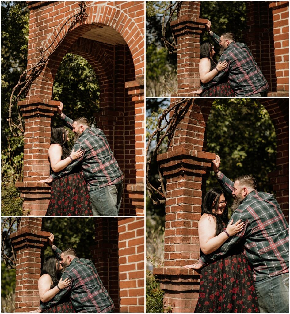 couple in a brick entrance during an engagement session at Oakland Cemetery in Atlanta georgia. Goth bride 2025