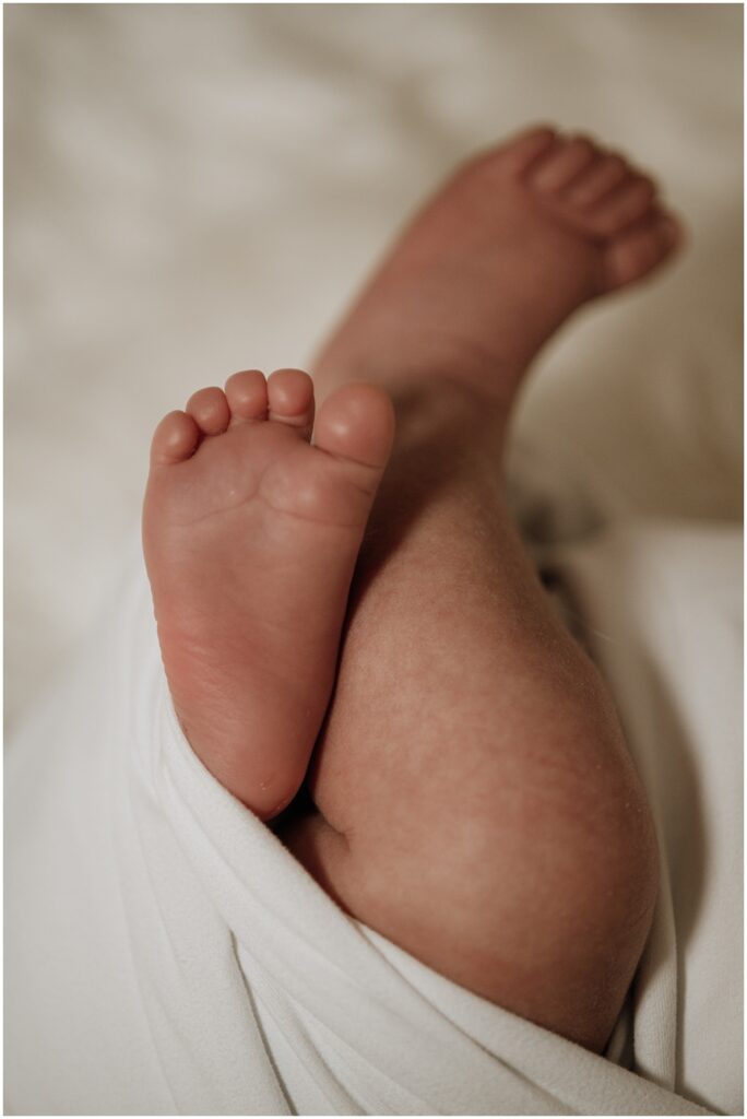 Flowery Branch photographer takes close up photos of the newborn during his newborn studio session 