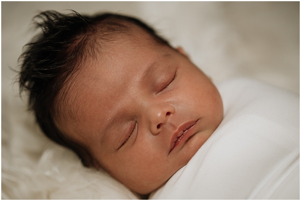 Flowery Branch photographer takes close up photos of the newborn during his newborn studio session 