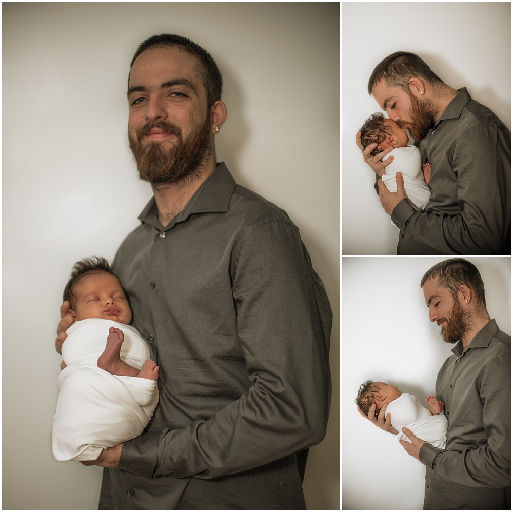 Flowery Branch photographer takes photo of the baby and his dad during the newborn session in the studio. Everyone is all smiles.