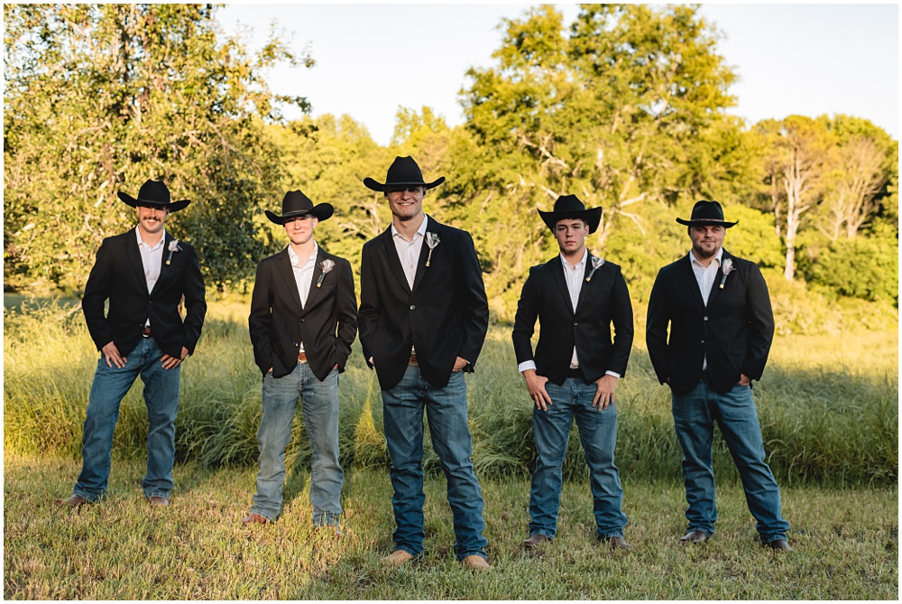 North Georgia photographer photographs a wedding in the country for a young couple in the north Georgia mountains. Photographed here is the Groom and Groomsmen out in the field 