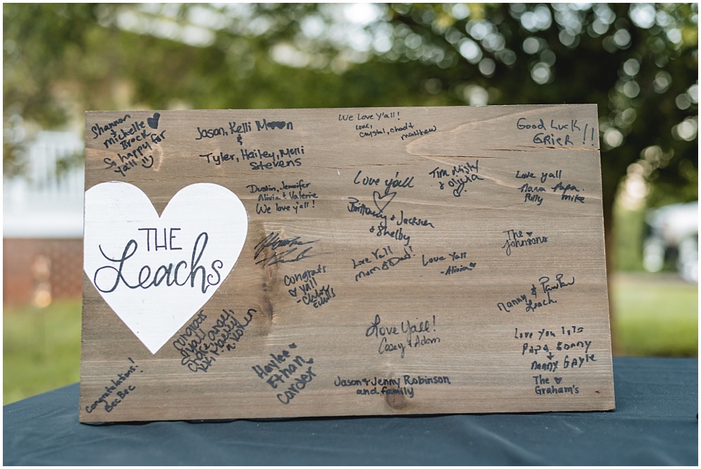 North Georgia photographer photographs a wedding in the country for a young couple in the north Georgia mountains. Photographed here is a board the guests signed for the Bride and Groom. 